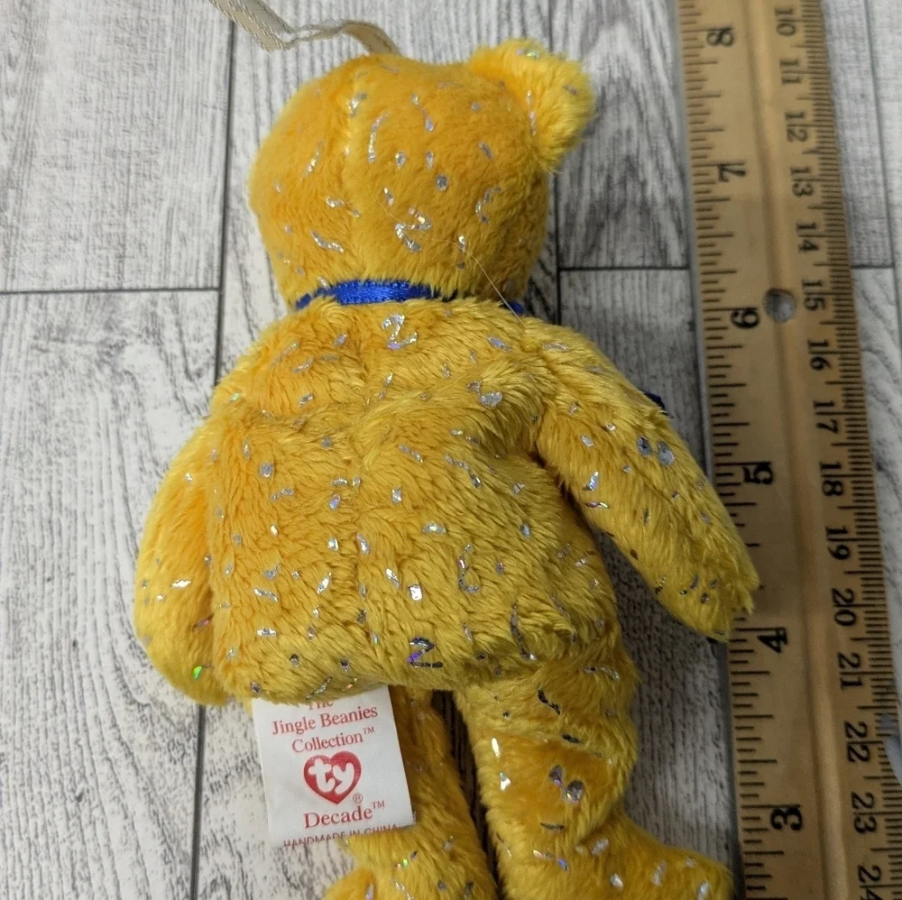 Ty Decade Sparkling Yellow Bear with Blue Ribbon and Bell